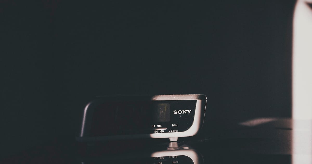 A digital alarm clock in a dark room